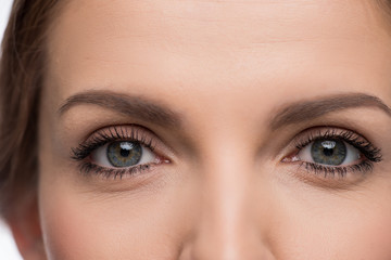 Close-up view of beautiful young woman with grey eyes