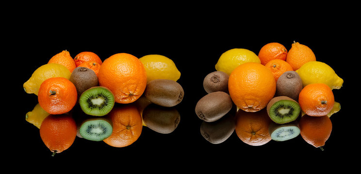 fresh fruits on a black background with reflection