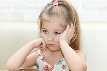Portrait of an insulted child. Crybaby. Discontent.
