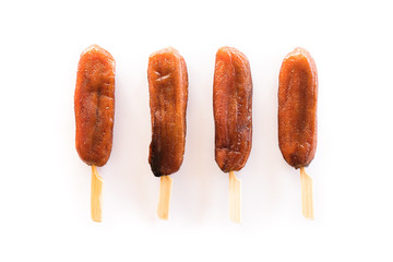 Organic dried banana split bamboo skewer on white background