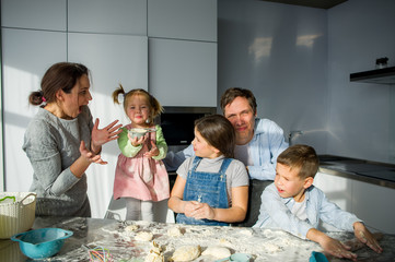 A family of five in the kitchen