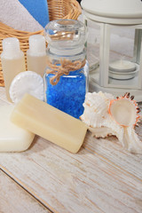 wicker basket with towel and sponge mini shampoo mini soap and sea salt with scallop with free space for text
