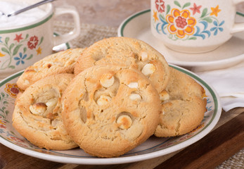 White chocolate macadamia nut cookies on a plate
