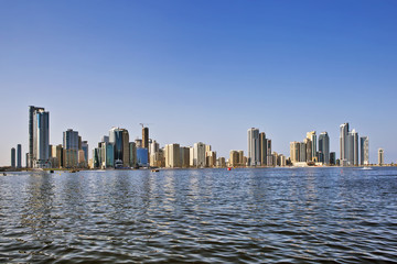Fototapeta na wymiar Skyscrapers on the shores of Laguna Khalid. Sharjah. United Arab Emirates