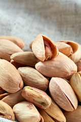 Pistachios on fabric cotton napkin, sallow depth of field, selective focus, top view, macro
