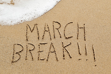 text march break in the sand of a beach
