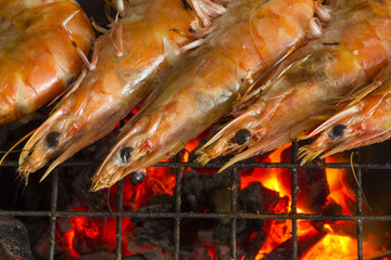 Grilled shrimps on the flaming grill.