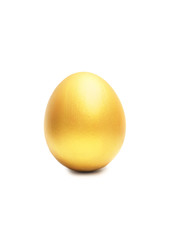 Golden egg isolated on white background with natural shadow
