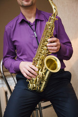 Fototapeta premium Man playing on saxophone
