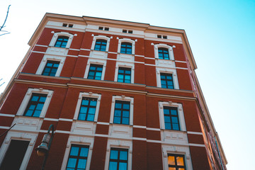 Obraz premium low angle view of red facaded brick building