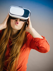 Girl wearing virtual reality goggles.