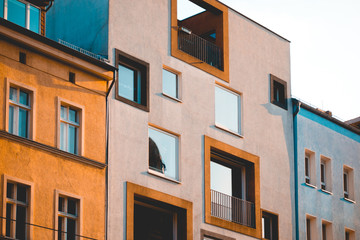modern square formed building with brown facade