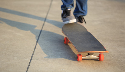 skateboarder legs skateboarding at skatepark