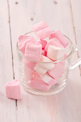 Marshmallows on wooden table. 