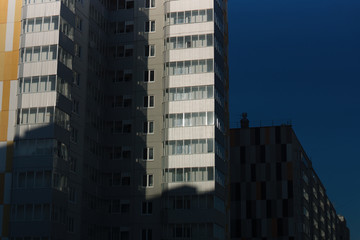 Fototapeta na wymiar Apartment houses in sunny day
