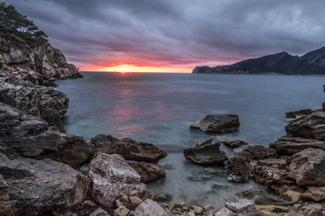 Obraz premium The picturesque fishing village of Sant Elm with the Sa Dragonera reserve in the background, Mjorca (Mallorca), Balearic Islands, Spain.