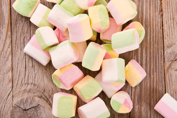 Marshmallows on wooden table. 