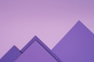 Purple paper mountains on light violet background