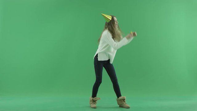 Charming happy young woman dances, chroma key on background