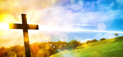 Religious representation with cross and nature landscape background