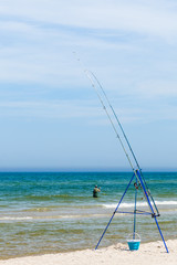 Fishing rod left alone on sea shore
