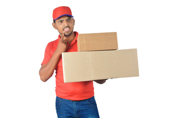 Confused delivery man holding carton box in uniform