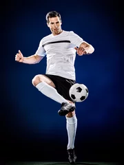 Fotobehang one caucasian soccer player man isolated on black background © snaptitude