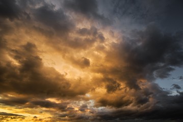 Naklejka na ściany i meble Dramatic Dark cloudy stormy sky in the evening