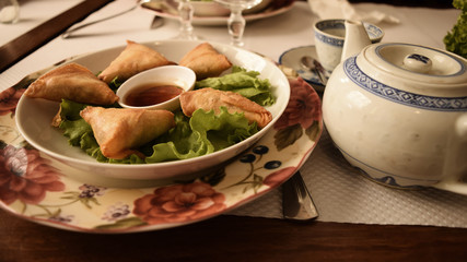 Asian food cuisine with teapot and and salad