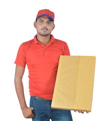 Happy delivery man holding gift pack, hand in pocket in uniform