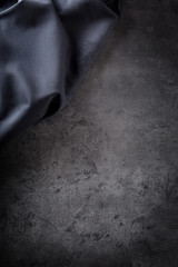 Black napkin tablecloth on black concrete board