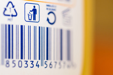Barcode numbers with garbage symbol and symbol for recycling on a plastic product
