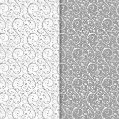 White and gray floral backgrounds. Set of seamless patterns