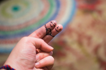 Fingers in love. The hand of man. Muzzles on the phalanges of the fingers. Love on the hand.