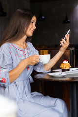 Young woman have a breakfast in cafe