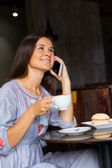 Young woman have a breakfast in cafe