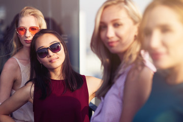 Nice young thai woman resting with her friends