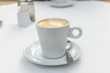 cup of coffee on a table in a cafe close-up