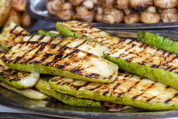 Freshly cooked vegetables on the grill, outdoors. Background of vegetables on the grill.