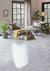 decorative living room corner style grey sofa and yellow blanket in the forest