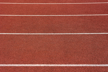 Red running track in stadium. Part of red running track
