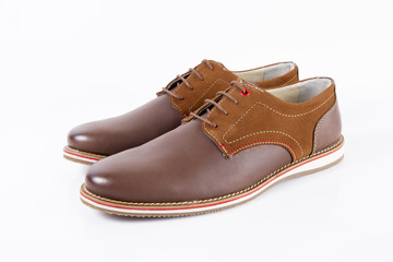 Male brown leather shoe on white background, isolated product, comfortable footwear.