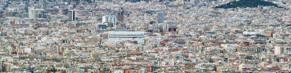 Obraz premium panorama aerial cityscape view of barcelona showing the dense crowded modern urban environment with housing and modern business developments