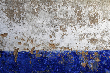 old white and blue wall texture with peeling paint