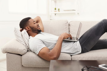 African-american man with laptop indoors