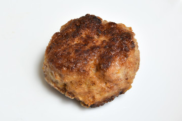 fried homemade meat cutlet on a white plate