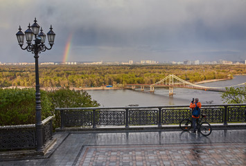 view of the pedestrian bridge Bridge and rainbow and the Dnieper river from above, Kyiv