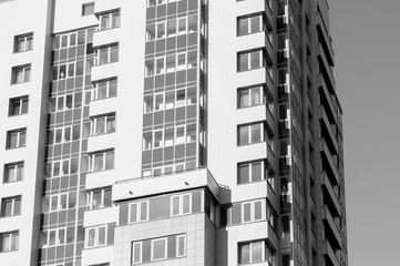 tall building in black and white against the background of a clear sky
