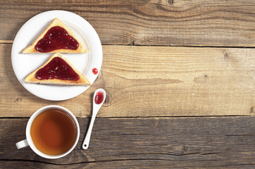 Tea and toasted bread with jam