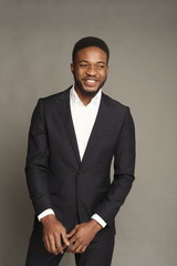 Happye young black man portrait at studio background.